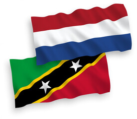 Flags of Federation of Saint Christopher and Nevis and Netherlands on a white background