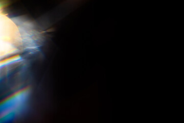 Blur colorful rainbow crystal light leaks on black background. Defocused abstract multicolored retro film lens flare bokeh analog photo overlay or screen filter effect. Glow Vintage prism colors