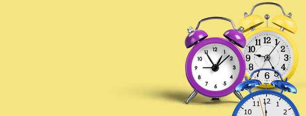 Alarm Clock and Time Management Concept with Soft Yellow Background and Copyspace Area, Time...