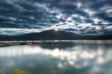 The tranquil and mysterious lake and mountains, the boat dock by the lake. Chaowu Pier, Sun Moon Lake National Scenic Area. Nantou County, Taiwan