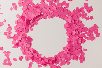 creative festive, lunar new year frame with pink confetti paper on white background, top view