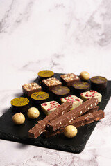 a variety of chocolates on a light background