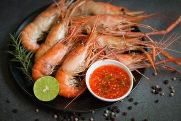 shrimp grilled delicious seasoning spices on black background appetizing cooked shrimps baked prawns rosemary lemon lime pepper, Seafood shelfish with seafood sauce