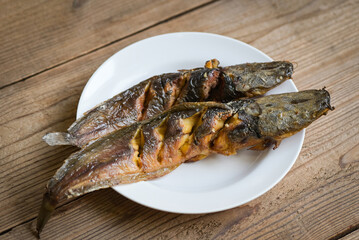 grilled catfish on white plate, Thailand food cooking catfish freshwater fish