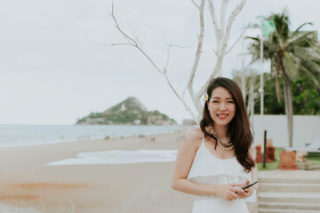 Beautiful asain woman relaxing on the beach

