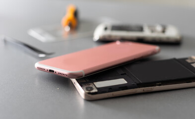Close-up photos showing process of mobile phone repair