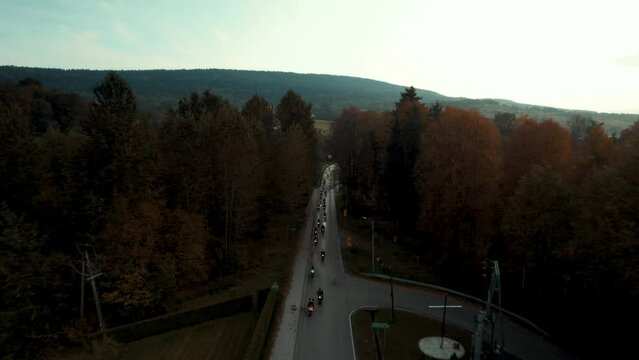 Bird Eye View Of Long Motorcycle Convoy. Drone Shot Of Group Of Bikers. Motorbike Meeting.