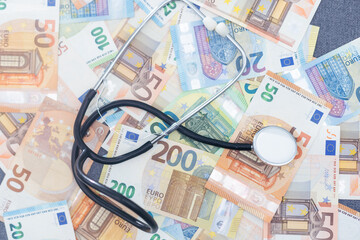 Stethoscope and Euro banknotes, Financial, account, statistics and business data medical health...