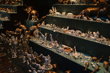 Dusselldorf, Germany - December 13, 2022: Christmas atmosphere at the open xmas market. Celebrating Xmas holidays. Lights, carousel, small houses, toys and decorations at fair in European city or town