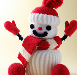 Close up of snowman with hat and scarf christmas decoration on beige background created using Generative AI technology