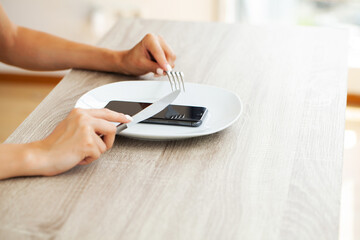 Fototapeta premium Attractive woman looking at smartphone screen, reading media news