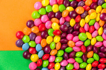 Skittles candy on the colorful table, colorful sweet candy
