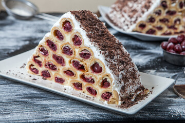 A traditional Moldavian dessert or cake consisting of pancakes with cherry, milk creme and chocolate creme also called Cosma lui Guguta.