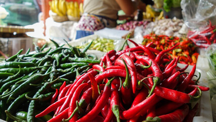 red and green chili peppers in the farmer market