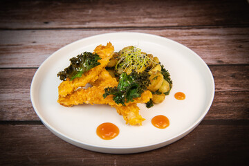Recipe for Breaded Chicken Tenders and Potatoes with Sesame Kale Chips and Sweet and Sour Sauce. High quality photo