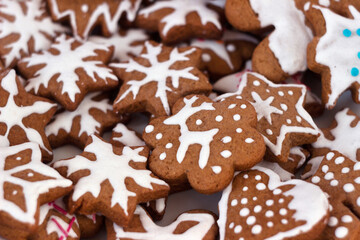 Spicy ginger cookies of different shapes in a plate. Winter New Year's pastries, background