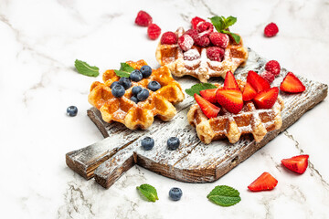 Traditional belgian waffles with fresh fruit on white background. banner, menu, recipe place for text, top view.