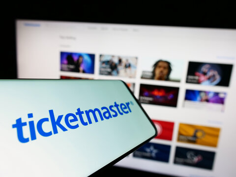 Stuttgart, Germany - 12-02-2022: Cellphone with logo of American company Ticketmaster Entertainment Inc. on screen in front of website. Focus on center-left of phone display.