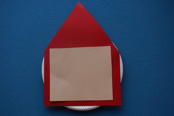 Christmas New Year Santa card handmade. Step by step photo instruction. DIY concept. Step 5-14. Cut a flesh-colored square and glue it to the red base. It's going to be a face. Top view, Flat lay
