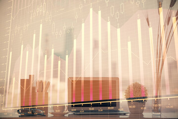 Forex Chart hologram on table with computer background. Double exposure. Concept of financial markets.