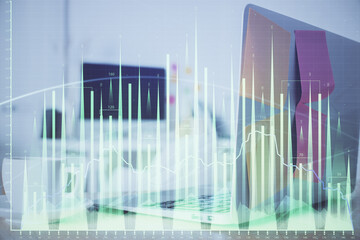 Forex Chart hologram on table with computer background. Double exposure. Concept of financial markets.