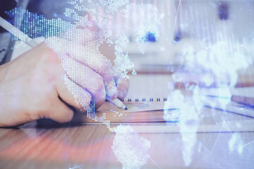Multi exposure closeup hands with stock market forex graph.