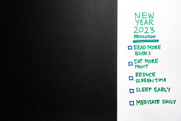 New Year 2023 resolution goals target wish list achievement checklist text in white blank paper...