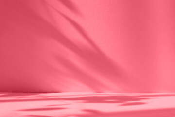 Abstract red studio background for product presentation. Empty room with shadows of window and...