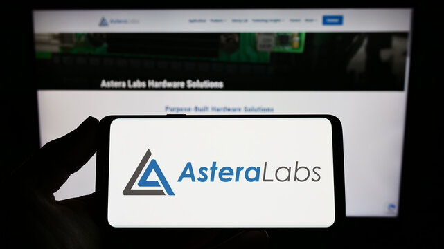 Stuttgart, Germany - 12-03-2022: Person holding smartphone with logo of US semiconductor company Astera Labs Inc. on screen in front of website. Focus on phone display.