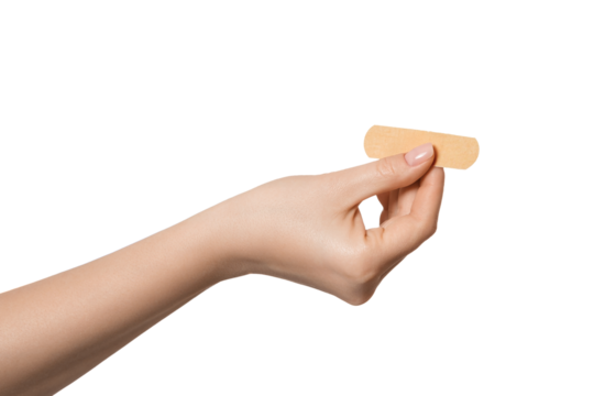 Band-aid in a female hand, isolate - Powered by Adobe