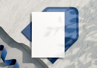 Mockup of a blank white card invitation View from above with a wooden background. with clipping...