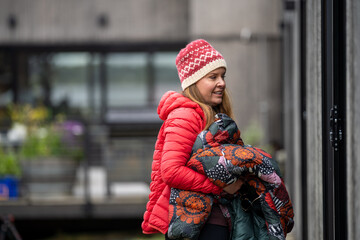 girl walking away from the camera in winer wearing a jacket