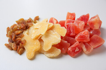 Pile of different dried fruits on white background
