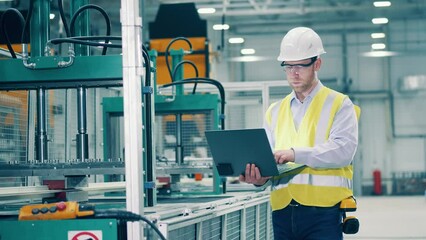 Industrial engineer is observing production process