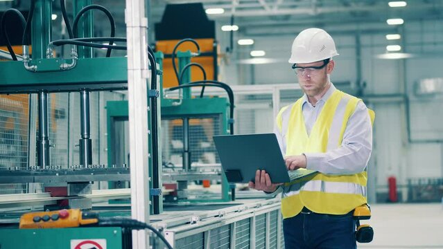 Industrial engineer is observing production process