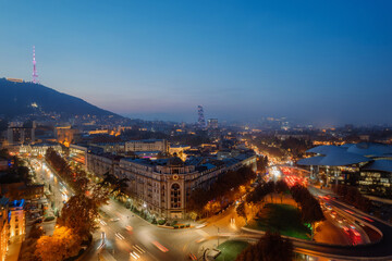 Night city view with modern buildings in Tbilisi, Georgia.  - 553986383