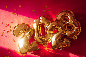 2023 shine foil balloons. New year sparkling background.