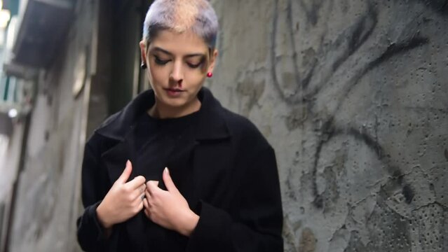 alternative contemporary beauty, in the streets of Naples, in the characteristic alleys at dawn on Sunday