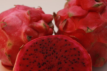 a close up of red dragon fruit isolated on white background. healthy food concept photo. fresh and...