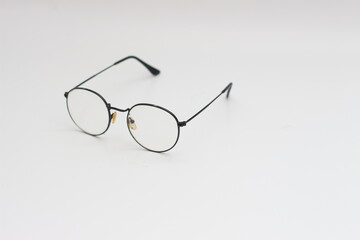 Fototapeta premium a close up of eyeglasses with black frames isolated on white background