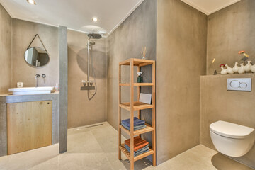 Tiled shower cabin near sink and mirror in light restroom in contemporary apartment