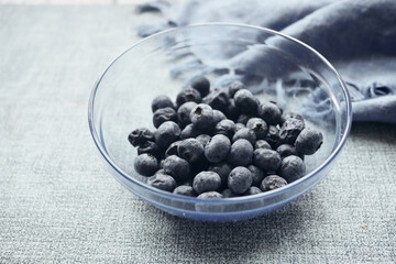 Close up of fresh blue berry with water drops .