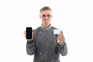 Happy smiling business man businessman boss showing smartphone and debit credit payment card