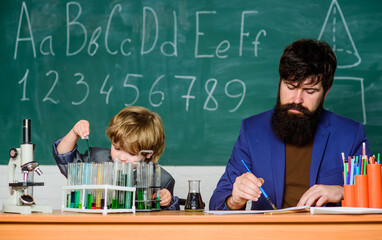 Study chemistry and biology. Studying is interesting. Study educational activity through experience. I love study in school. Personal example and inspiration. Teacher and boy in chemical laboratory