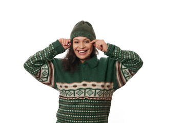 Emotional portrait on white background of pretty woman in warm woolen clothes, rejoicing and smiling a toothy smile looking at camera. Happy brunette expressing positivity, cheerfulness and happiness