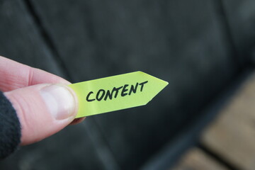 Content concept, lettering on tag on vintage background.