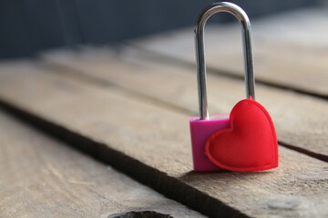 Padlock with a heart on a vintage background.