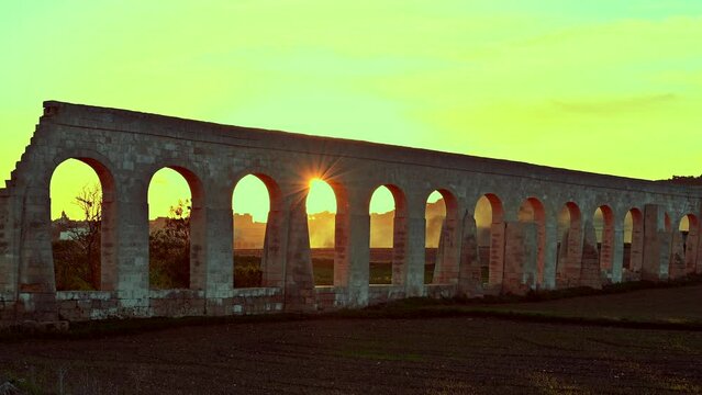 Mystic colors Sunset at the Gozo Roman style Aqueduct  on the island of Gozo, Malta. It was built by the British between 1839 and 1843 to transport water from Għar Ilma ito Victoria
