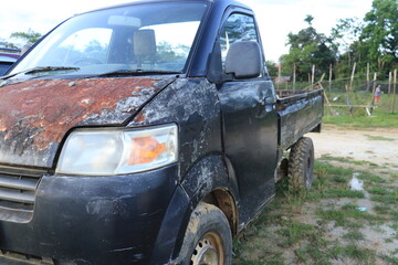 Old rusty black pickup truck
