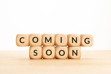 Coming soon phrase on wooden blocks